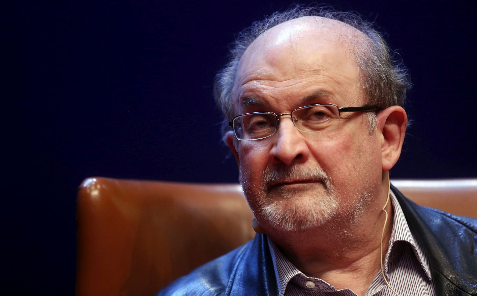 epa10117473 (FILE) - Indian-British writer Salman Rushdie presents his book 'Two Years Eight Months and Twenty-Eight Nights' in Aviles, Spain, 07 October 2015 (reissued 12 August 2022). Rushdie and an interviewer were attacked while on stage at an event in Chautauqua, New York State, USA, on 12 August 2022. The suspect was taken into custody, New York State police said. Rushdie, who was apparently stabbed in the neck, was transported to a hospital. His condition is not yet known.  EPA/JL CEREIJIDO *** Local Caption *** 53580620