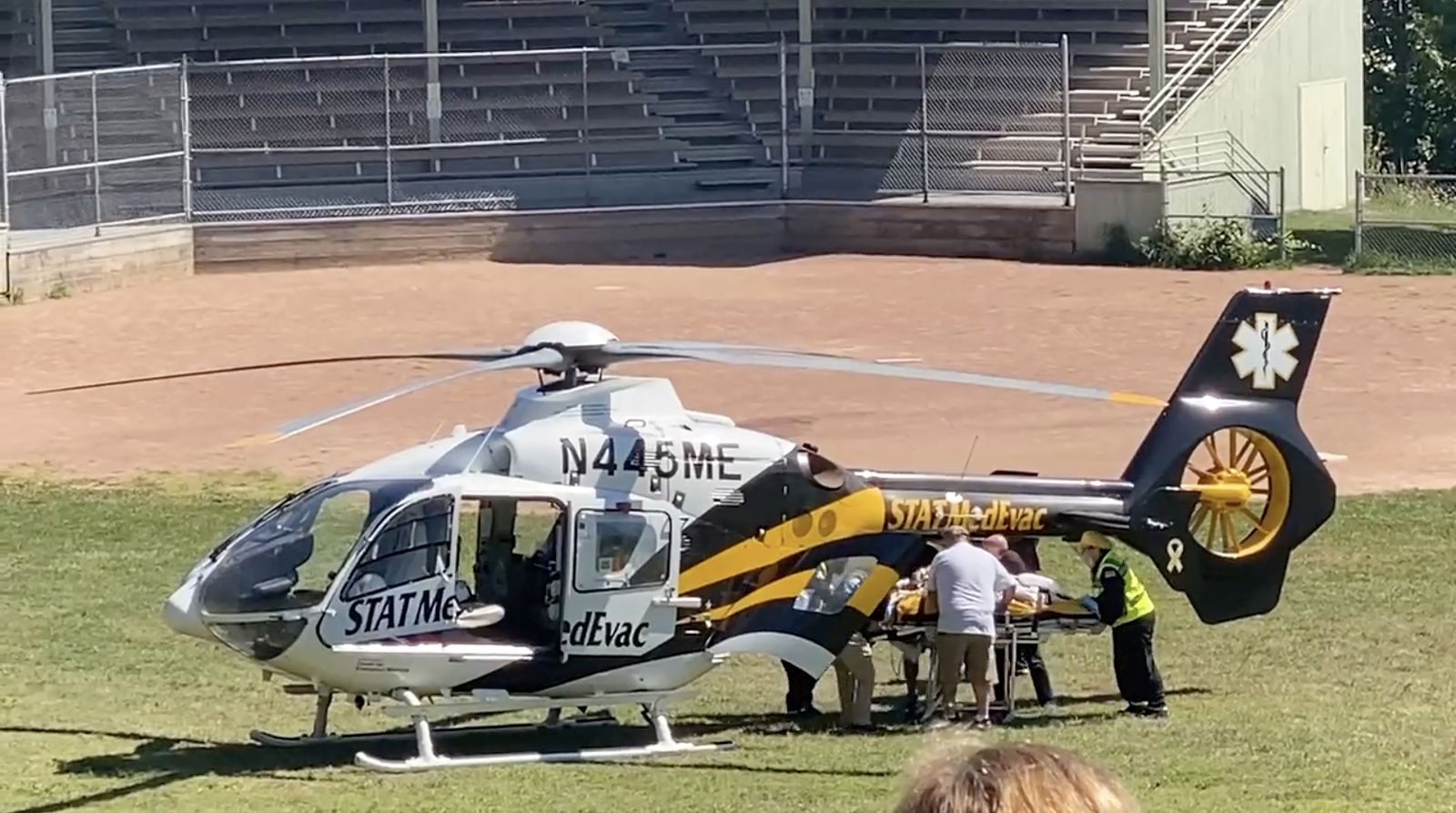 epa10117603 Frame grab from a video released via Twitter user @HoratioGates3 and used with permission, showing Salman Rushdie being loaded into a MedEvac helicopter after he and an interviewer were attacked while on stage at an event in Chautauqua, New York State, USA, 12 August 2022. The suspect was taken into custody, New York State police said. Rushdie, who was reportedly stabbed in the neck, was transported to a hospital.  EPA/@HoratioGates3 EDITORIAL USE ONLY, NO SALES HANDOUT EDITORIAL USE ONLY/NO SALES