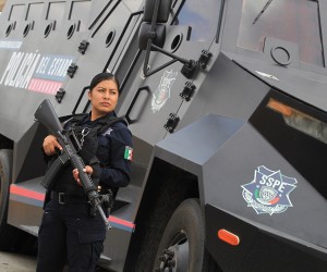 epa10124381 Liliana Moreno Holguin, a Mexican police officer originally from the Tarahumara, or self-called Raramuri indigenous people, poses during an interview in Ciudad Juarez, Mexico, 15 August 2022 (issued 16 August 2022). Liliana has made history as the first indigenous woman to enter the ranks of the Police in the northern state of Chihuahua.  EPA/LUIS TORRES