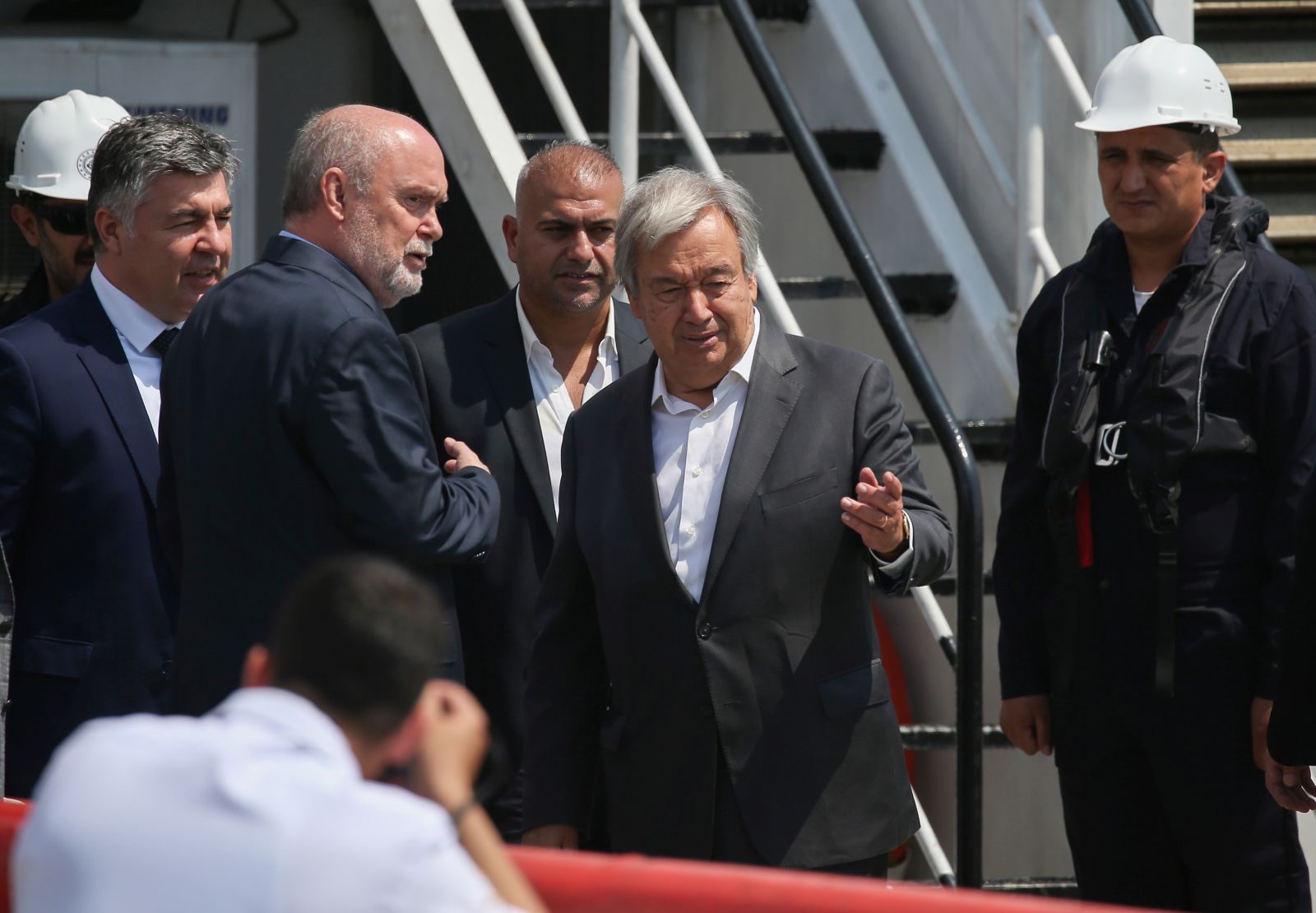 epa10130264 UN Secretary-General Antonio Guterres (C) arrives at the Zeyport to inspect a grain shipment before his Joint Coordination Center (JCC) in Istanbul, Turkey, 20 August 2022. A safe passage deal was signed between Ukraine and Russia to export Ukrainian grain on 22 July in Istanbul.  EPA/ERDEM SAHIN