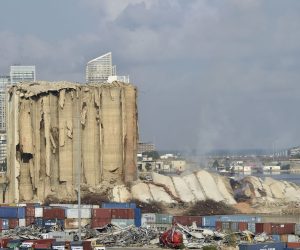 epa10134208 Dust rises after a section of the wheat silos collapsed at the Port of Beirut, Lebanon, 23 August 2022. The Beirut Port wheat silos, damaged by the Beirut Port blast of 2020, began to collapse on 31 July 2022, while another part came down on 04 August, on the second anniversary of the explosion. A third section collapsed on 23 August 2022.  EPA/WAEL HAMZEH