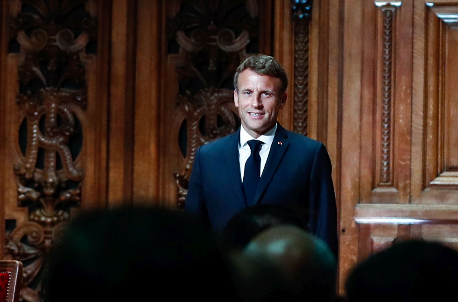 epa10137485 French President Emmanuel Macron (C) and State Secretary for Youth and National Education Sarah El Hairy (L), arrive to the amphitheater of the Sorbonne University in Paris, France, 25 August 2022. French President Emmanuel Macron makes trip to the Sorbonne University at the opening of the back-to-school meeting of rectors, as France is struggling to recruit enough teachers. This visit is the first by a President of the Republic to take part in such an event.  EPA/MOHAMMED BADRA / POOL
