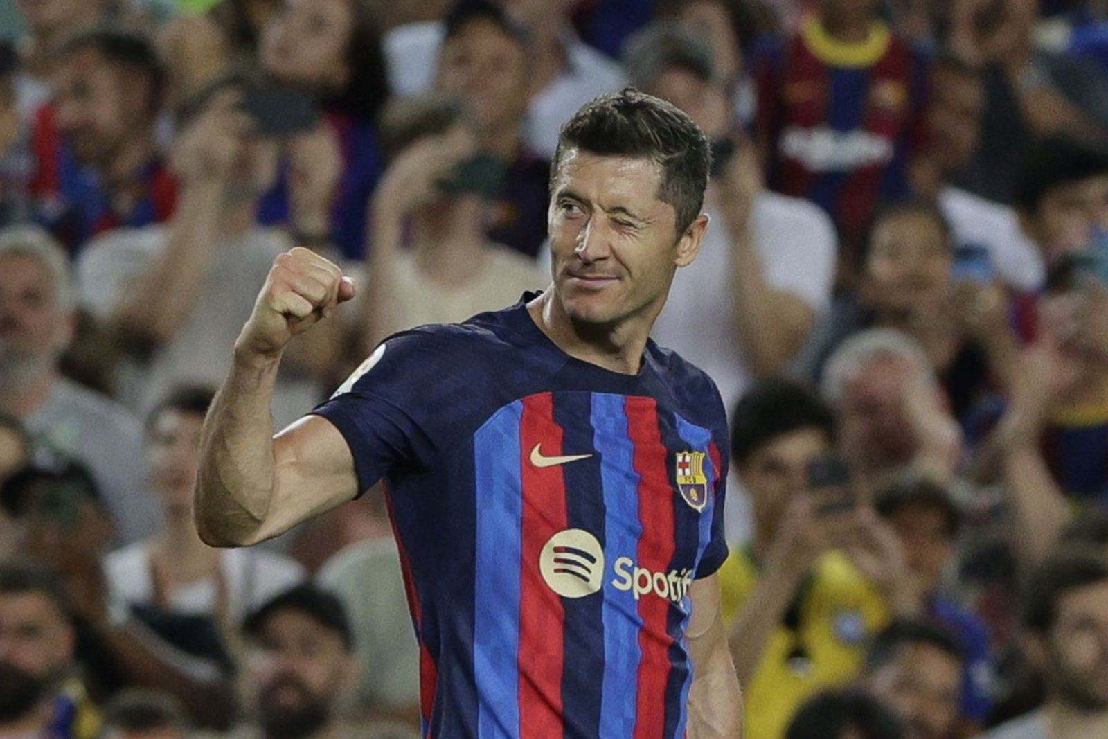 epa10144143 FC Barcelona's striker Robert Lewandowski celebrates after scoring the 3-0 goal during the Spanish LaLiga soccer match between FC Barcelona and Real Valladolid CF held at Spotify Camp Nou stadium in Barcelona, Spain, 28 August 2022.  EPA/Quique Garcia