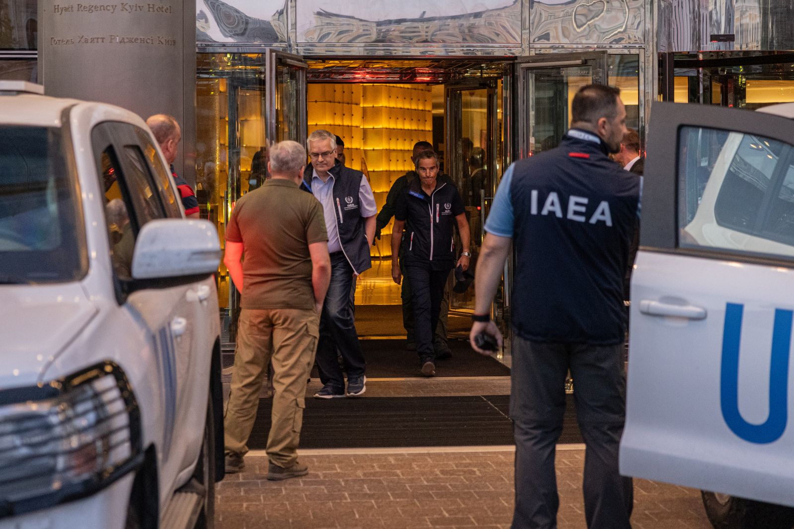 epa10148973 International Atomic Energy Agency (IAEA) Director-General Rafael Mariano Grossi (C) with other IAEA members depart from a hotel in Kyiv as they are expected to visit the Zaporizhzhya Nuclear Power Plant, Ukraine, 31 August 2022. IAEA Director-General Rafael Grossi leads an IAEA expert mission that comprises IAEA nuclear safety, security, and safeguards staff as they set for their official visit in Ukraine to the Zaporizhzhya Nuclear Power Plant (ZNPP).  EPA/ROMAN PILIPEY