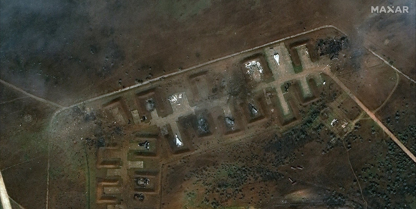 epa10115458 A handout satellite image made available by Maxar Technologies shows the aftermath of a reported attack on the Russian Saki airbase at Novofedorivka, Crimea, Ukraine, 10 August 2022 (issued 11 August 2022). Russia said that the explosions that happened on 09 August were accidental and no aircraft was damaged, whereas Ukraine said that Russia lost nine combat aircraft at the airbase in Crimea.  EPA/MAXAR TECHNOLOGIES HANDOUT -- MANDATORY CREDIT: SATELLITE IMAGE 2022 MAXAR TECHNOLOGIES -- THE WATERMARK MAY NOT BE REMOVED/CROPPED -- HANDOUT EDITORIAL USE ONLY/NO SALES