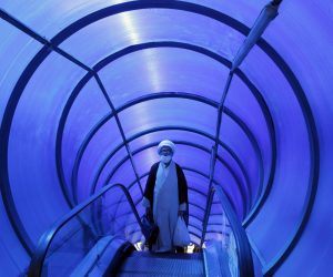 epaselect epa10137520 An Iranian cleric takes pedestrian bridge elevator in a street in Tehran, Iran, 25 August 2022. According to Iranian foreign ministry, Iran has received US answer to its nuclear deal on 24 August 2022. The ministry also reported that Tehran will respond to US and EU soon. Iran has responded on 16 August 2022 officially to top European Union proposal aimed at salvaging 2015 nuclear deal with world powers, and was waiting for US and EU response. Iran is facing economic crisis over sanctions by US and EU.  EPA/ABEDIN TAHERKENAREH