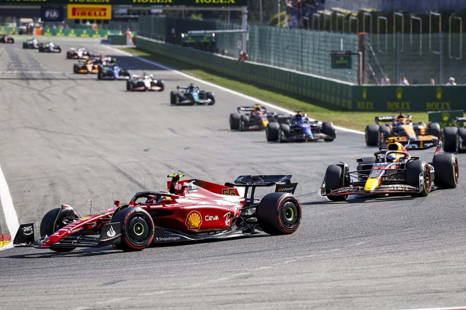 epa10143443 Spanish Formula One driver Carlos Sainz of Scuderia Ferrari leads the pack during the Formula One Grand Prix of Belgium at the Spa-Francorchamps race track in Stavelot, Belgium, 28 August 2022.  EPA/STEPHANIE LECOCQ