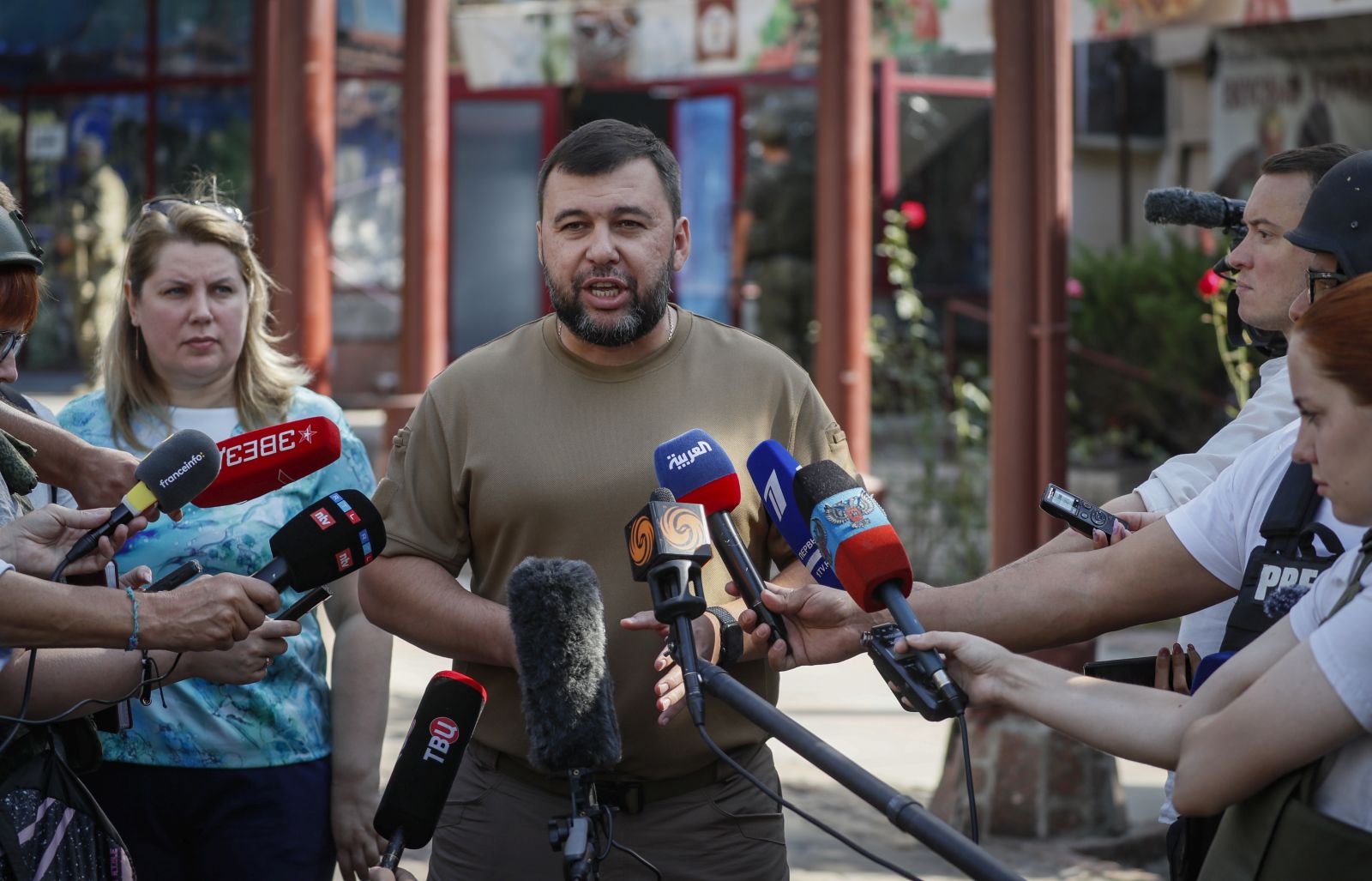 epa10147927 A picture taken during a visit to Donetsk organised by the Russian military shows Head of the self-proclaimed Donetsk People's Republic Denis Pushilin speaking with journalists near hotel Central damaged after shelling in Donetsk, Ukraine, 30 August 2022. On 24 February 2022 Russian troops entered the Ukrainian territory in what the Russian president declared a 'Special Military Operation', starting an armed conflict that has provoked destruction and a humanitarian crisis.  EPA/YURI KOCHETKOV