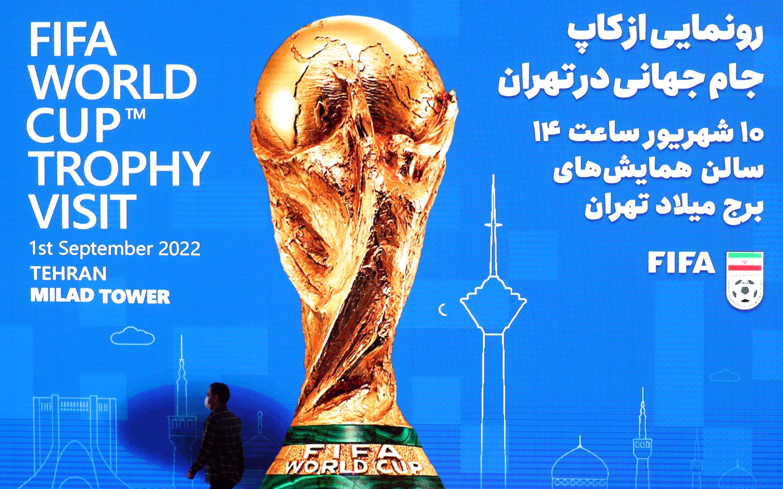 epa10152381 An Iranian official walks during a ceremony to unveil the FIFA World Cup Trophy at a hall in Milad Tower complex, in Tehran, Iran, 01 September 2022 as part of the global trophy tour.  EPA/ABEDIN TAHERKENAREH
