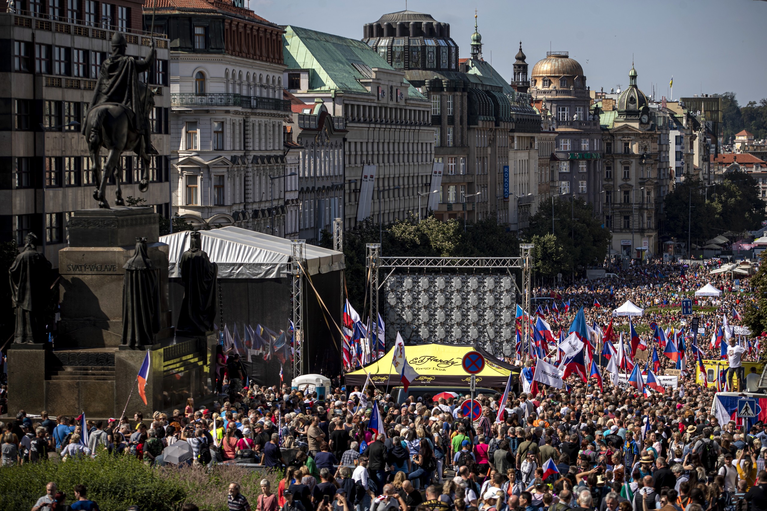 epa10157195 People wave national flags as they protest against Czech government at Wenceslas Square in Prague, Czech Republic, 03 September 2022. According to Czech police, 70.000 people attended a protest calling for the government to resign, while demanding mitigation of the energy crisis and repair of the damage.  EPA/MARTIN DIVISEK