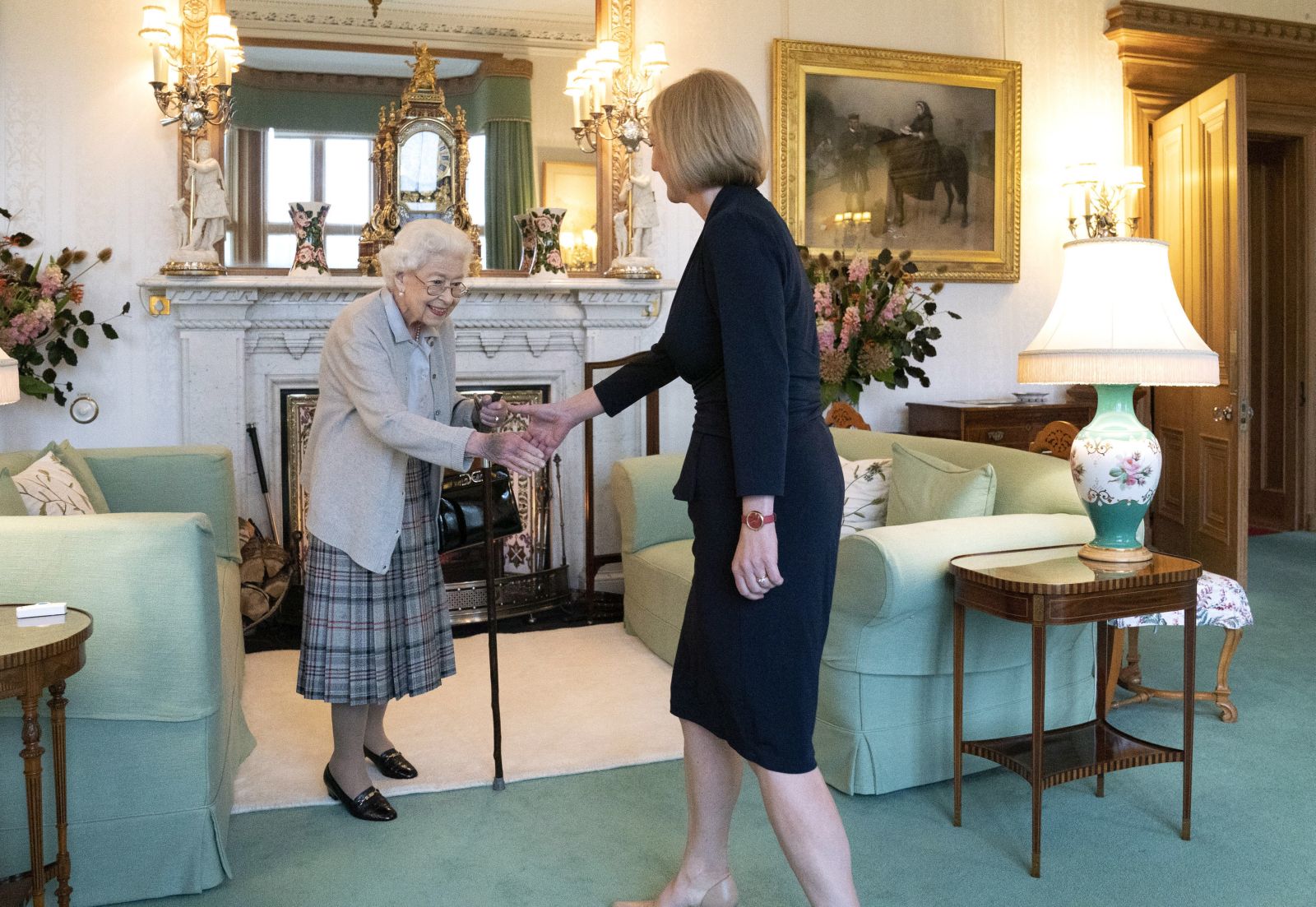 epa10164089 Queen Elizabeth II welcomes Liz Truss during an audience at Balmoral, Scotland, Britain 06 September 2022. Truss was in Balmoral for an audience with Queen Elizabeth II where she was invited to become Prime Minister and form a new government.  EPA/Andrew Milligan / POOL