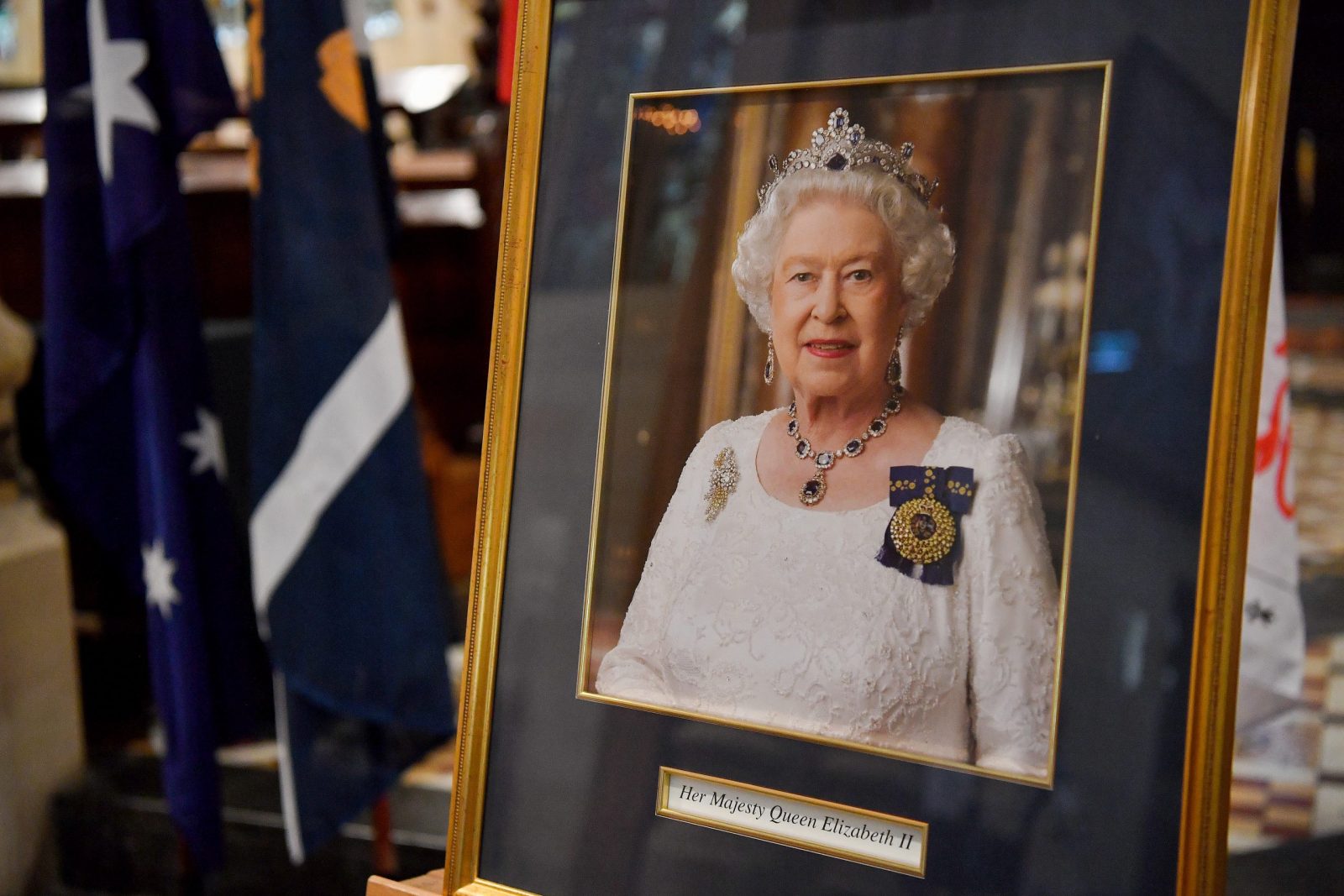 epa10172028 A photograph of Queen Elizabeth II is displayed at St. Andrew's Cathedral in Sydney, Australia, 09 September 2022. According to a statement issued by Buckingham Palace on 08 September 2022, Britain's Queen Elizabeth II has died at her Scottish estate, Balmoral Castle, on 08 September 2022. The 96-year-old Queen was the longest-reigning monarch in British history.  EPA/BIANCA DE MARCHI AUSTRALIA AND NEW ZEALAND OUT