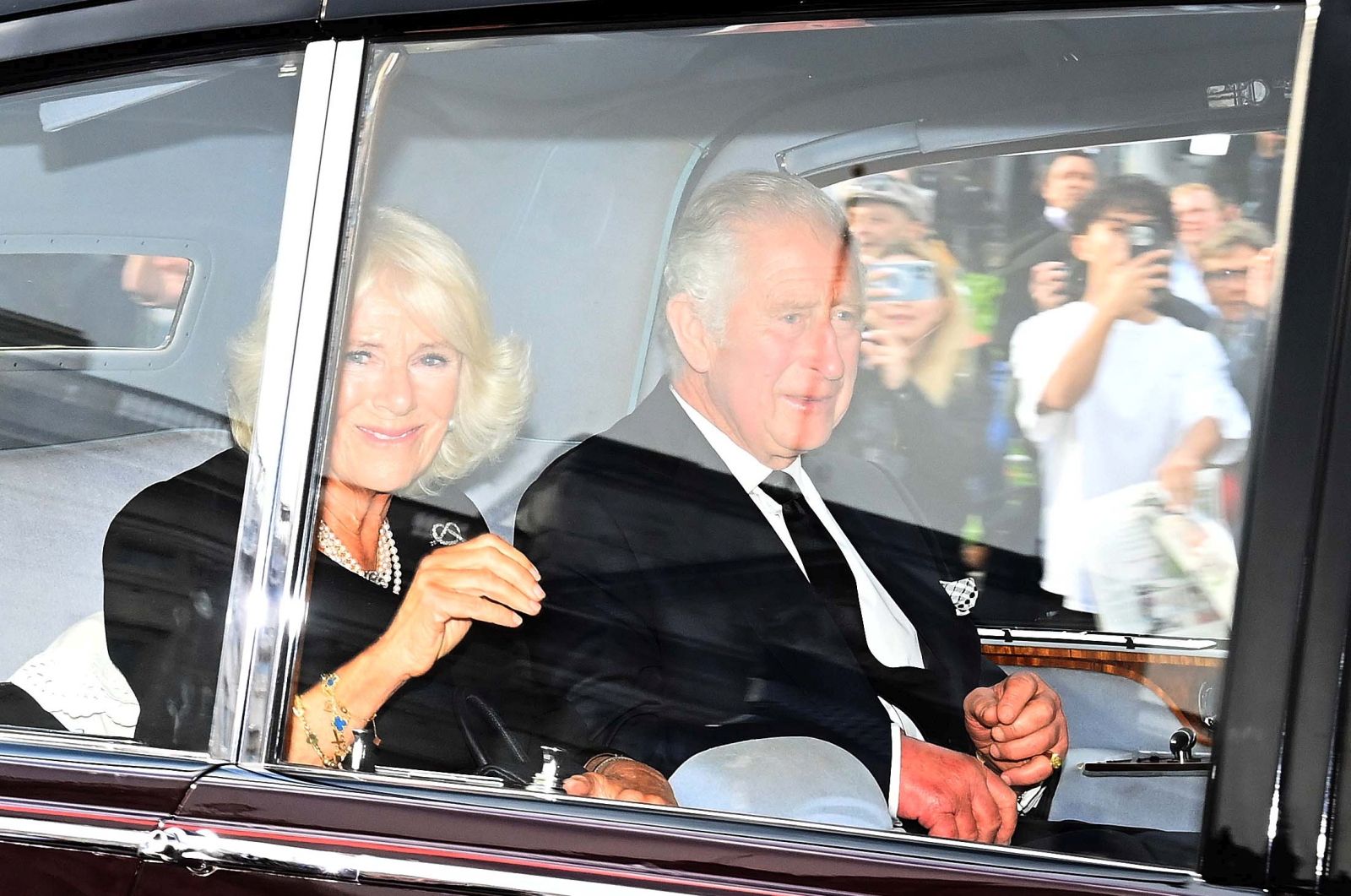 epa10174083 Britain's King Charles III (R) and Queen Consort Camilla, leave Buckingham Palace in London, Britain, 09 September 2022. Britain's Queen Elizabeth II died at her Scottish estate, Balmoral Castle, on 08 September 2022. The Prince of Wales became King after the death of his mother and will be known as King Charles III.  EPA/NEIL HALL