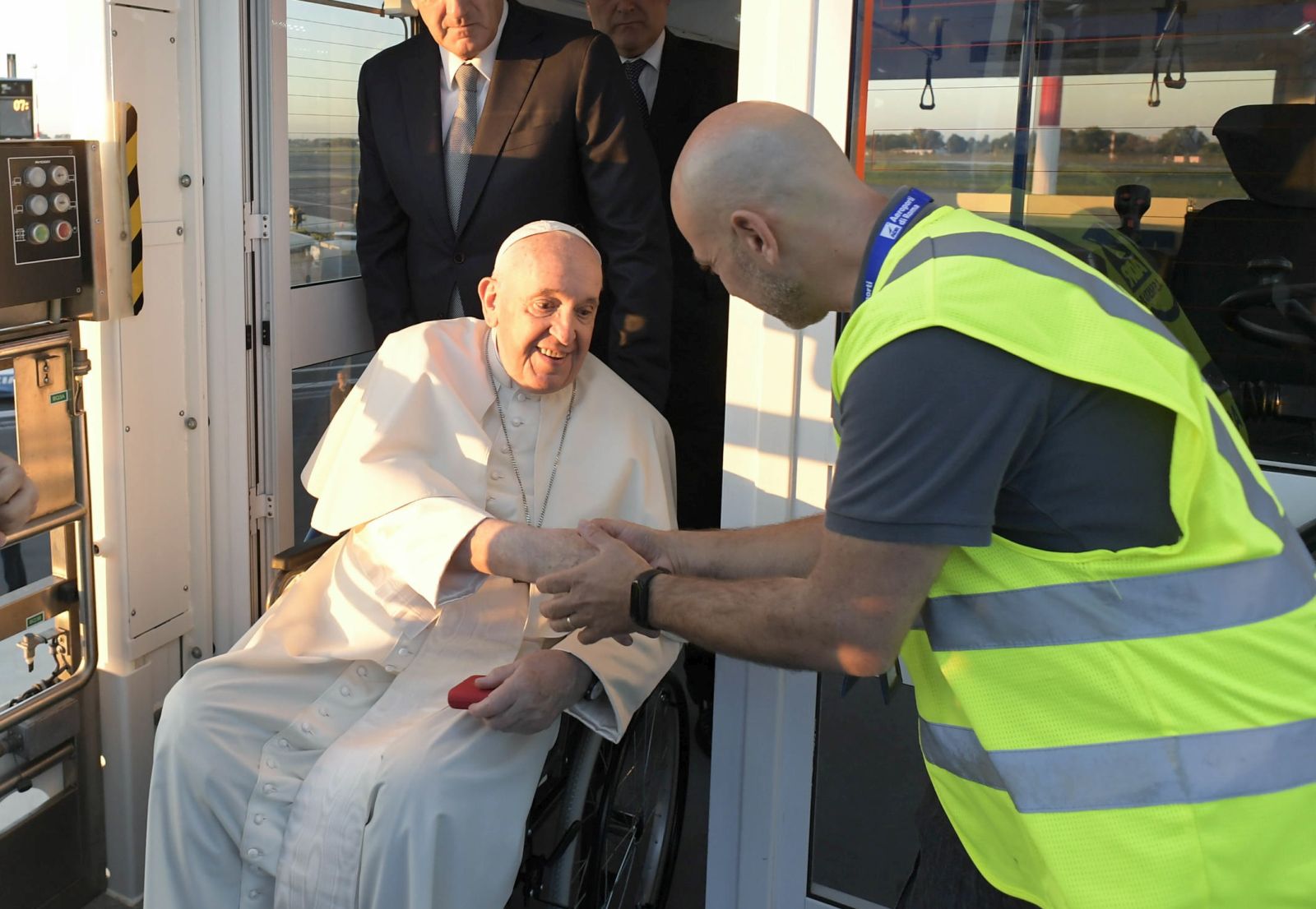epa10180890 A handout picture provided by the Vatican Media shows Pope Francis (C) boarding a plane from a lift designed for the boarding and disembarking of reduced mobility passengers, at Fiumicino Leonardo Da Vinci Airport, Italy, 13 September 2022. Pope Francis departs for a three-day trip to Kazakhstan.  EPA/VATICAN MEDIA HANDOUT  HANDOUT EDITORIAL USE ONLY/NO SALES