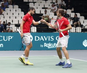 epa10186747 Croatian players Nikola Mektic (L) and Mate Pavic (R) react during their doubles match  against Swedish players Mikael Ymer and Elias Ymer at the Davis Cup Finals group A tie between Croatia and Sweden in Casalecchio, near Bologna, Italy, 15 September 2022.  EPA/ELISABETTA BARACCHI
