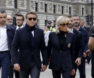 epa10191787 French President Emmanuel Macron (C-L) and his wife Brigitte Macron (C-R) arrive at Westminster Hall to pay their respects to Britain's late Queen Elizabeth II in London, Britain, 18 September 2022. The queen's funeral will be held on 19 September, following four days of lying in state inside Westminster Hall.  EPA/OLIVIER HOSLET