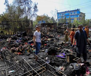 epa10191759 People survey the burnt-out, auction market that sells used items after a fire broke out, in Kabul, Afghanistan, 18 September 2022.  Residents said that the fire caused huge financial losses. The cause of the fire is unknown.  EPA/STRINGER