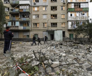 epa10196288 People walk among debris after night shelling in Kharkiv, northeastern Ukraine, 21 September 2022. Apartment blocks were hit in night shelling on Kholodnohirsky district, Mayor of Kharkiv Ihor Terekhov said on Telegram. Information about casualties was being assessed, he added. The Ukrainian army pushed Russian troops from occupied territory in the northeast of the country in a counterattack. Kharkiv and surrounding areas have been the target of heavy shelling since February 2022, when Russian troops entered Ukraine starting a conflict that has provoked destruction and a humanitarian crisis.  EPA/OLEG PETRASYUK