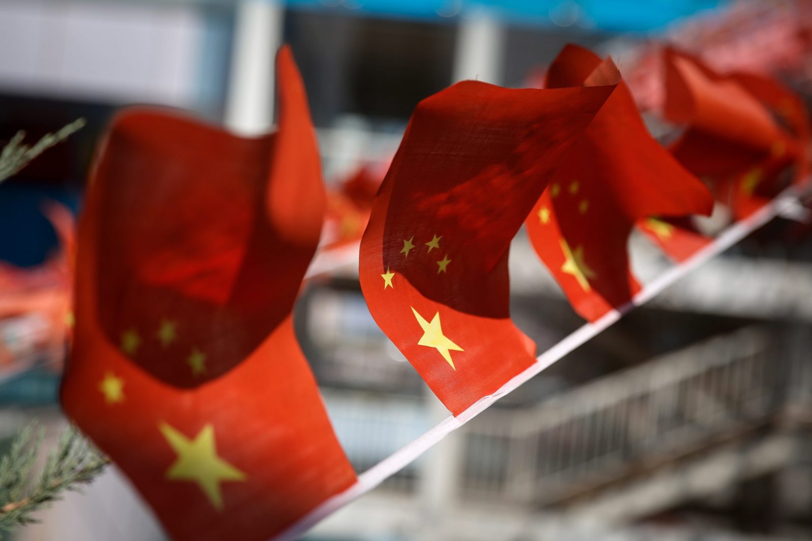 epa10196754 Flags of China flutter at a mall in Beijing, China, 21 September 2022. The European Chamber of Commerce warned China that firms are losing confidence in the country as an investment destination, citing erratic COVID-19 policy shifts as one of its reasons.  EPA/MARK R. CRISTINO