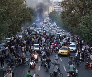 epa10197708 People clash with police during a protest  following the death of Mahsa Amini, in Tehran, Iran, 21 September 2022. Mahsa Amini, a 22-year-old Iranian woman, was arrested in Tehran on 13 September by the morality police, a unit responsible for enforcing Iran's strict dress code for women. She fell into a coma while in police custody and was declared dead on 16 September, with the authorities saying she died of a heart failure while her family advising that she had no prior health conditions. Her death has triggered protests in various areas in Iran and around the world. According to Iran's state news agency IRNA, Iranian President Ebrahim Raisi expressed his sympathy to the family of Amini on a phone call and assured them that her death will be investigated carefully. Chief Justice of Iran Gholam-Hossein Mohseni-Eje'i assured her family that upon its conclusion, the investigation results by the Iranian Legal Medicine Organization will be announced without any special considerations.  EPA/STR