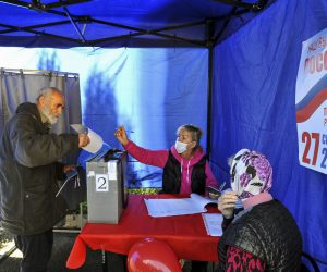 epa10204182 A refugee from Ukraine (L) casts his ballots at a polling station in a temporary accommodation facility for refugees during voting in a referendum on the joining of Russian-controlled regions of Ukraine to Russia, in Novocherkassk, Rostov region, Russia, 24 September 2022. From 23 to 27 September, residents of the self-proclaimed Luhansk and Donetsk People's Republics as well as the Russian-controlled areas of the Kherson and Zaporizhzhia regions of Ukraine vote in a referendum to join the Russian Federation. On 24 February 2022 Russian troops entered the Ukrainian territory in what the Russian president declared a 'Special Military Operation', starting an armed conflict that has provoked destruction and a humanitarian crisis. Since then, more than 3.3 million refugees from eastern and southern Ukraine have entered Russia through the Rostov region, according to data published on 22 September by the press service of its regional government.  EPA/STRINGER