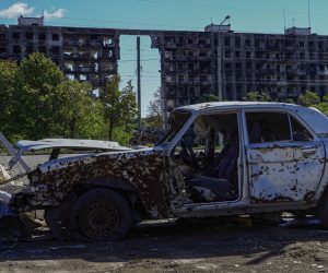 epa10206242 A damaged car in front of a destroyed building in Mariupol, eastern Ukraine, 25 September 2022. From 23 to 27 September, residents of the self-proclaimed Luhansk and Donetsk People's Republics as well as the Russian-controlled areas of the Kherson and Zaporizhzhia regions of Ukraine vote in a referendum to join the Russian Federation. On 24 February 2022 Russian troops entered the Ukrainian territory in what the Russian president declared a 'Special Military Operation', starting an armed conflict that has provoked destruction and a humanitarian crisis.  EPA/STRINGER