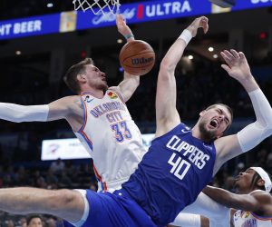 Oct 25, 2022; Oklahoma City, Oklahoma, USA; Oklahoma City Thunder center Mike Muscala (33) and LA Clippers center Ivica Zubac (40) collide on a play during the second half at Paycom Center. Oklahoma City won 108-94. Mandatory Credit: Alonzo Adams-USA TODAY Sports