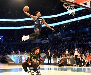 February 16, 2019 - Charlotte, NC, USA - The New York Knicks Dennis Smith Jr., dunks over entertainer J. Cole, after Cole threw the ball up in the air, during the AT&T Slam Dunk Contest at Spectrum Center in Charlotte, N.C., on Saturday, Feb. 16, 2019. AT&T Slam Dunk Contest  - ZUMAm67_ 20190216_zaf_m67_078 Copyright: xDavidxT.xFosterxIiix