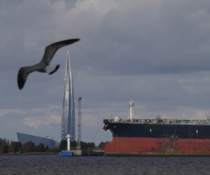 epa10195291 An oil tanker is seen by the Lakhta Centre business tower (L), the headquarters of Russian energy corporation Gazprom, in St. Petersburg, Russia, 20 September 2022.  EPA/ANATOLY MALTSEV
