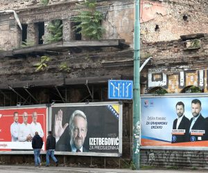 epa10211479 People walk past election campaign posters in Sarajevo, Bosnia and Herzegovina, 28 September 2022. More than three million Bosnian citizens are expected to vote in the country's general elections on 02 October. 90 political parties and 10 candidates for the three members of the Bosnian presidency were registered.  EPA/FEHIM DEMIR