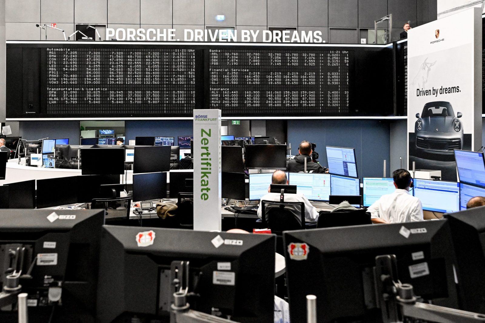 epa10213204 A trader watch monitors during the initial public offering (IPO) of German car manufacturer Porsche at the Frankfurt Stock Exchange in Frankfurt am Main, Germany, 29 September 2022. With the largest IPO in Germany in 25 years, German automaker Volkswagen has set the placement price for the preferred shares at 82.50 euro in consultation with Porsche AG and the advising banks. This gives Porsche a stock market value of 75 billion euros. Porsche shares will be traded on the Frankfurt Stock Exchange for the first time on 29 September 2022.  EPA/SASCHA STEINBACH