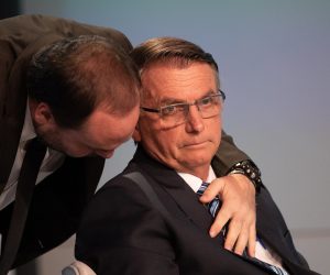 epa10214661 Incumbent President and candidate Jair Bolsonaro (R), listens to his son Carlos during a presidential debate at TV Globo studios in Rio de Janeiro, Brazil, 29 September 2022. Brazil will hold general elections on 02 October 2022.  EPA/ANDRE COELHO