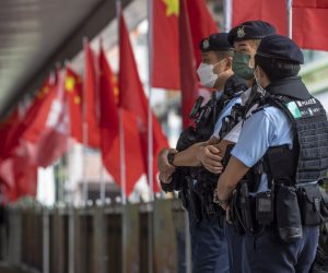 epa10216781 Police officers stand guard during China's National Day in Hong Kong, China, 01 October 2022. China celebrates its National Day on 01 October 2022, marking the 73rd founding anniversary of the People's Republic of China.  EPA/MIGUEL CANDELA