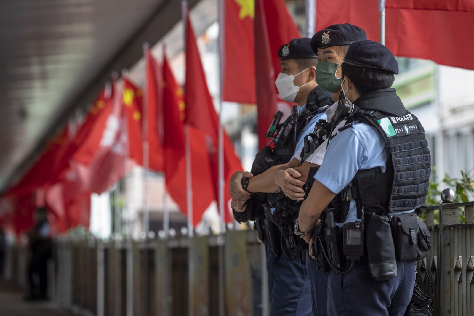 epa10216781 Police officers stand guard during China's National Day in Hong Kong, China, 01 October 2022. China celebrates its National Day on 01 October 2022, marking the 73rd founding anniversary of the People's Republic of China.  EPA/MIGUEL CANDELA
