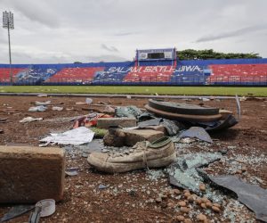 epa10220733 Shoes that were left behind during the soccer match riot and stampede are seen on the pitch at Kanjuruhan Stadium in Malang, East Java, Indonesia, 03 October 2022. Indonesia's National Police Chief General Listyo Sigid Prabowo announced that at least 125 people, including police officers, were killed after Indonesian police officers fired tear gas to stop soccer fans from entering the pitch causing panic and stampede, following the match between Arema FC and Persebaya Surabaya in East Java on 01 October. The Football Association of Indonesia temporarily suspended the 2022/2023 Liga 1 competition for one week, and prohibited Arema FC from hosting for the rest of the competition this season.  EPA/MAST IRHAM