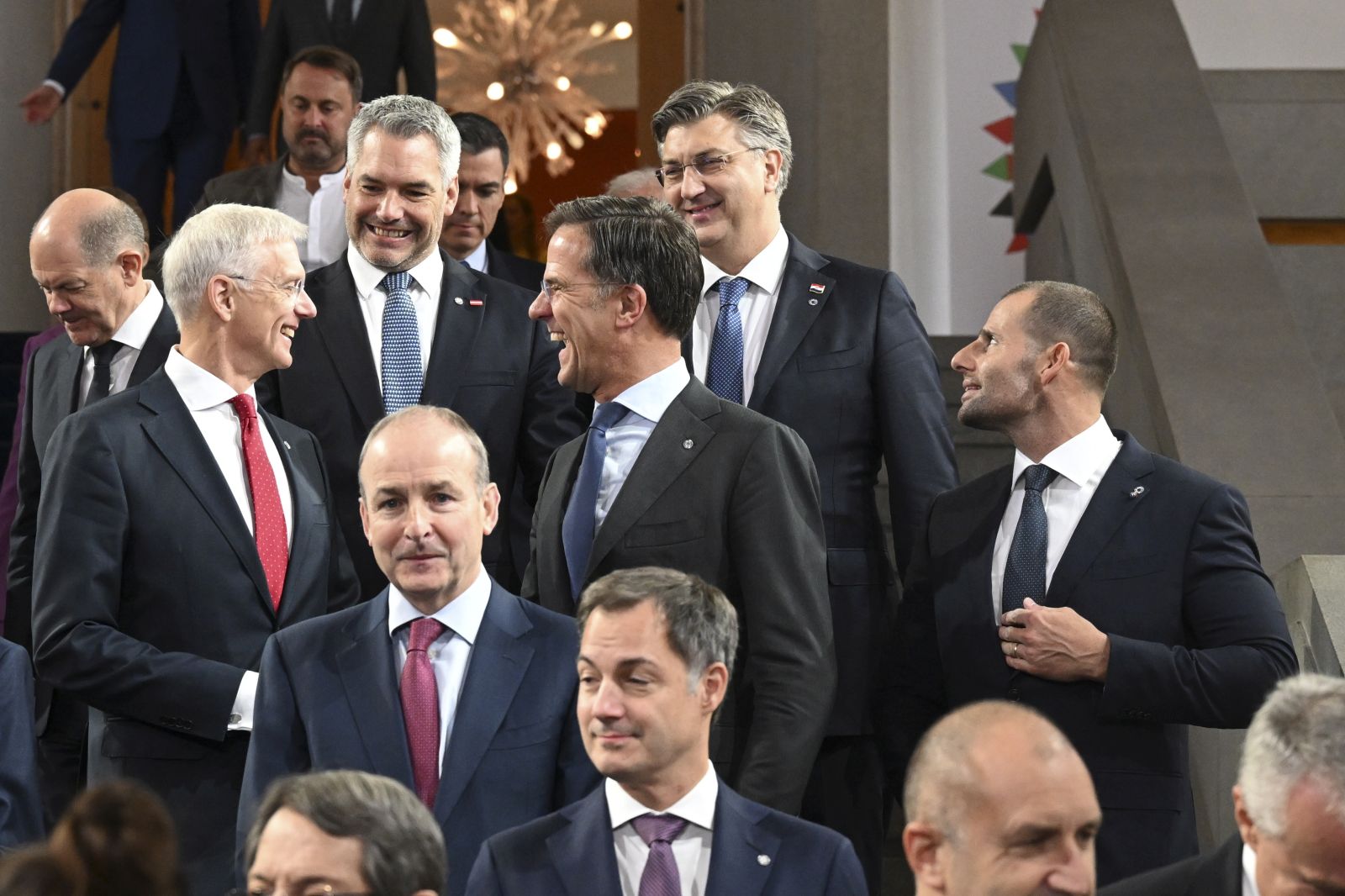 epa10228749 Latvian Prime Minister Krisjanis Karins (2-L) jokes with Austrian Chancellor Karl Nehammer (3-L), Dutch Prime Minister Mark Rutte (3-R) and Croatian Prime Minister Andrej Plenkovic (2-R) during an informal EU summit in Prague, Czech Republic, 07 October 2022. EU leaders will meet in the Czech capital to discuss pressing issues such as Russia's invasion of Ukraine and the block's energy and economic situation.  EPA/FILIP SINGER