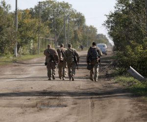 epa10229457 Ukrainian soldier patrol in the village of Pesky-Radkivski about 150km east of Kharkiv, Ukraine, 07 October 2022. The Ukrainian army pushed Russian troops from occupied territory in the northeast of the country in a counterattack. Kharkiv and surrounding areas have been the target of heavy shelling since February 2022, when Russian troops entered Ukraine starting a conflict that has provoked destruction and a humanitarian crisis.  EPA/ATEF SAFADI