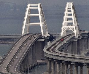 epa10232212 Cars move on the Kerch Strait bridge in Crimea, 09 October 2022. Automobile traffic on the undamaged part of the Crimean bridge has been restored, the head of the annexed Crimea Sergey Aksyonov announced. The previous day, Russian authorities said that "an explosion was set off at a cargo vehicle on the motorway part of the Crimean bridge on the side of the Taman peninsula, which set fire to seven fuel tanks of a train that was en route to the Crimean peninsula. Two motorway sections of the bridge partially collapsed."  EPA/STRINGER