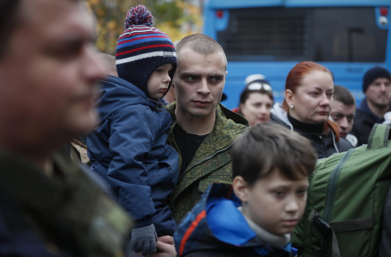 epa10238559 Russian conscripted man holds his child near a recruiting office during Russia's partial military mobilization in Moscow, Russia, 12 October 2022. Russian President Putin announced in a televised address to the nation on 21 September, that he signed a decree on partial mobilization in the Russian Federation due to the conflict in Ukraine. Russian Defense Minister Shoigu said that 300,000 people would be called up for service as part of the move.  EPA/YURI KOCHETKOV
