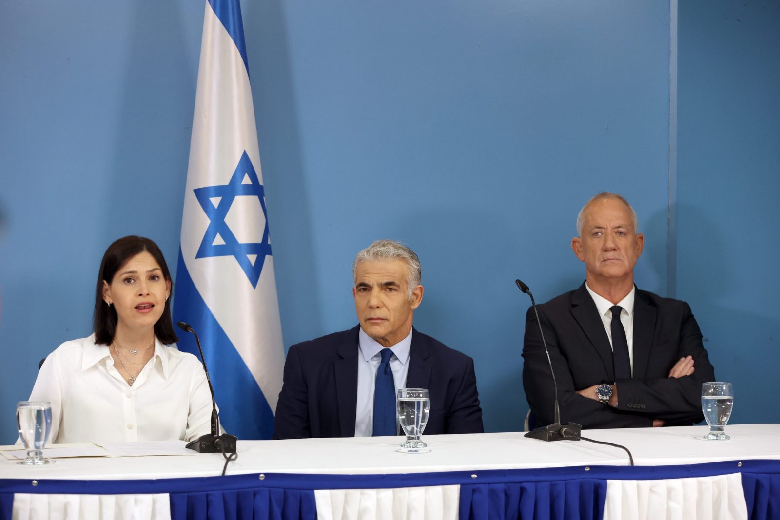 epa10239112 Israeli Prime Minister Yair Lapid (C), Defense Minister Benny Gantz (R) and Minister of Energy Karin Elharar (L) deliver a media statement regarding the maritime agreement between Israel and Lebanon at the Prime Minister's office in Jerusalem, 12 October 2022. The agreement focuses at Karish gas drilling site operated by Energean company and located in the Mediterranean Sea, in the economic waters of Israel, about 90 kilometers west of the coast of Israel, near the northern border between Israel and Lebanon.  EPA/ABIR SULTAN