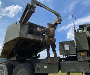 epa10240080 A US Marine works on a light multiple rocket launcher M142 High Mobility Artillery Rocket System (HIMARS) during a military exercise in Capas, Tarlac province, Philippines, 13 October 2022. The Philippines hosted simultaneous combat drills with the United States, South Korea, and Japan to improve interoperability in times of conflict.  EPA/FRANCIS R. MALASIG