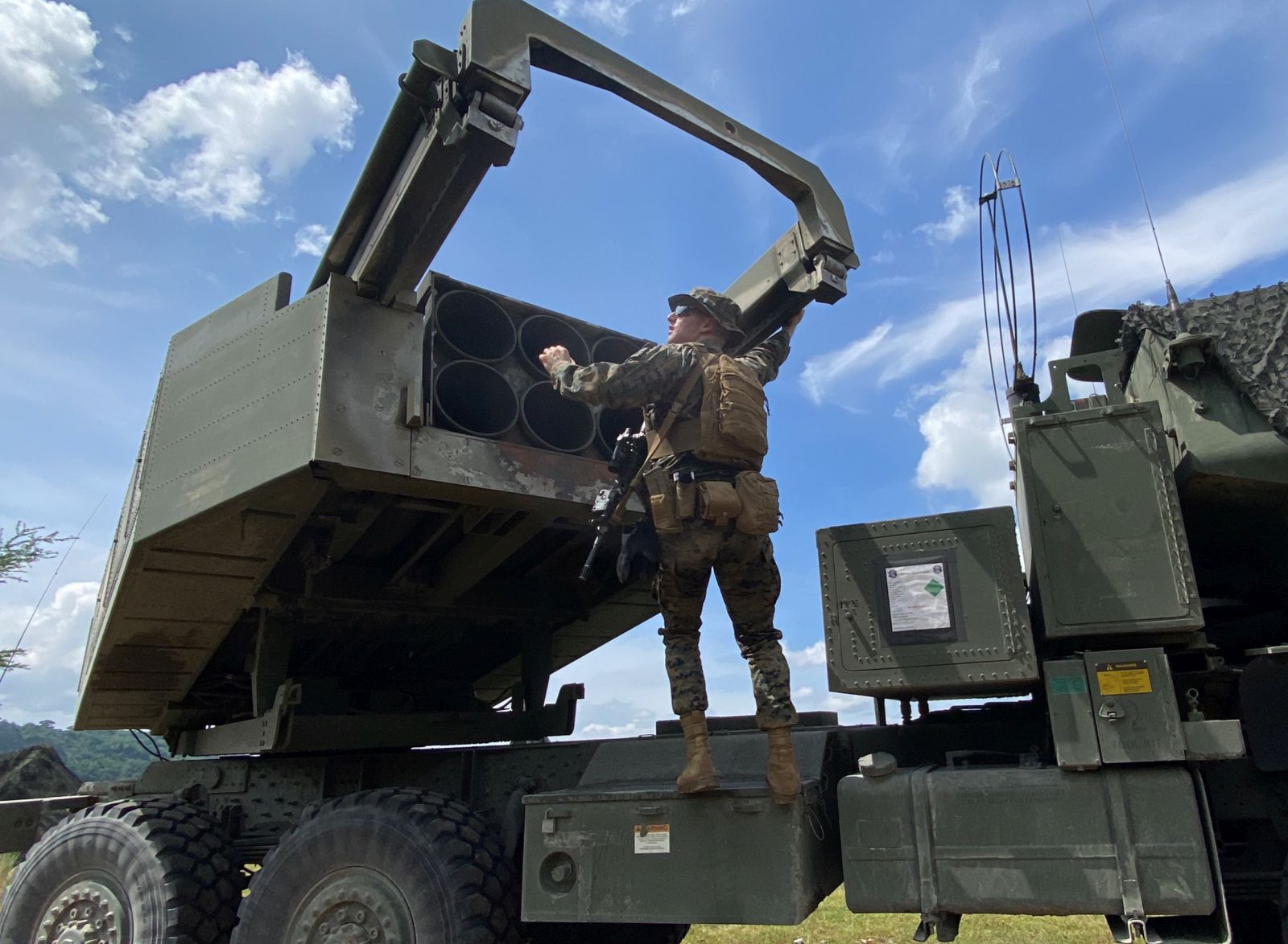 epa10240080 A US Marine works on a light multiple rocket launcher M142 High Mobility Artillery Rocket System (HIMARS) during a military exercise in Capas, Tarlac province, Philippines, 13 October 2022. The Philippines hosted simultaneous combat drills with the United States, South Korea, and Japan to improve interoperability in times of conflict.  EPA/FRANCIS R. MALASIG