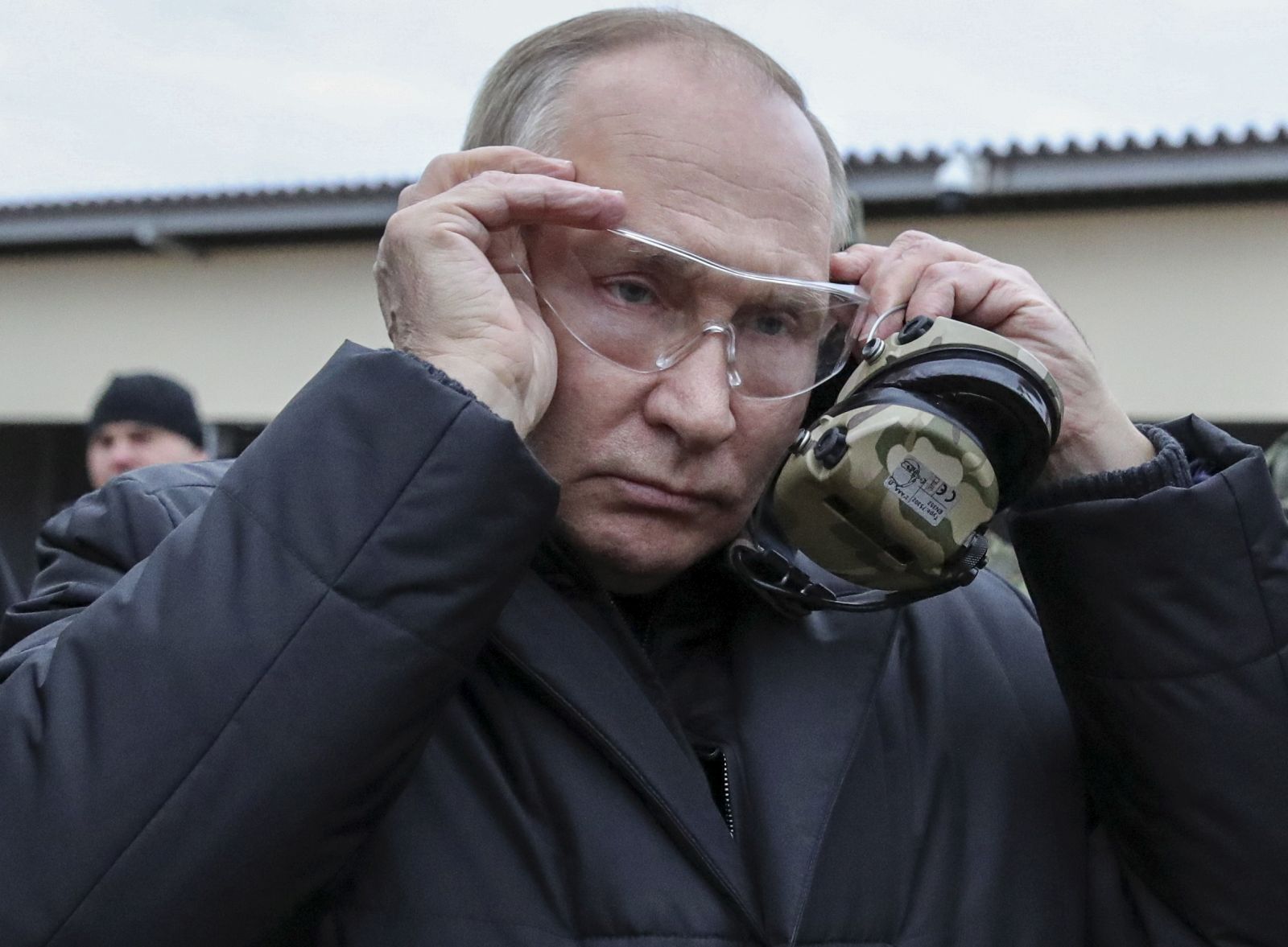 epa10255165 Russian President Vladimir Putin puts on tactical glasses as he inspects the progress of mobilized servicemen's training at a training range of the Western Military District in the Ryazan region, Russia, 20 October 2022. Russian President Putin announced in a televised address to the nation on 21 September, that he signed a decree on partial mobilization in the Russian Federation due to the conflict in Ukraine. Russian Defense Minister Shoigu said that 300,000 people would be called up for service as part of the move.  EPA/MIKHAEL KLIMENTYEV / SPUTNIK / KREMLIN POOL MANDATORY CREDIT