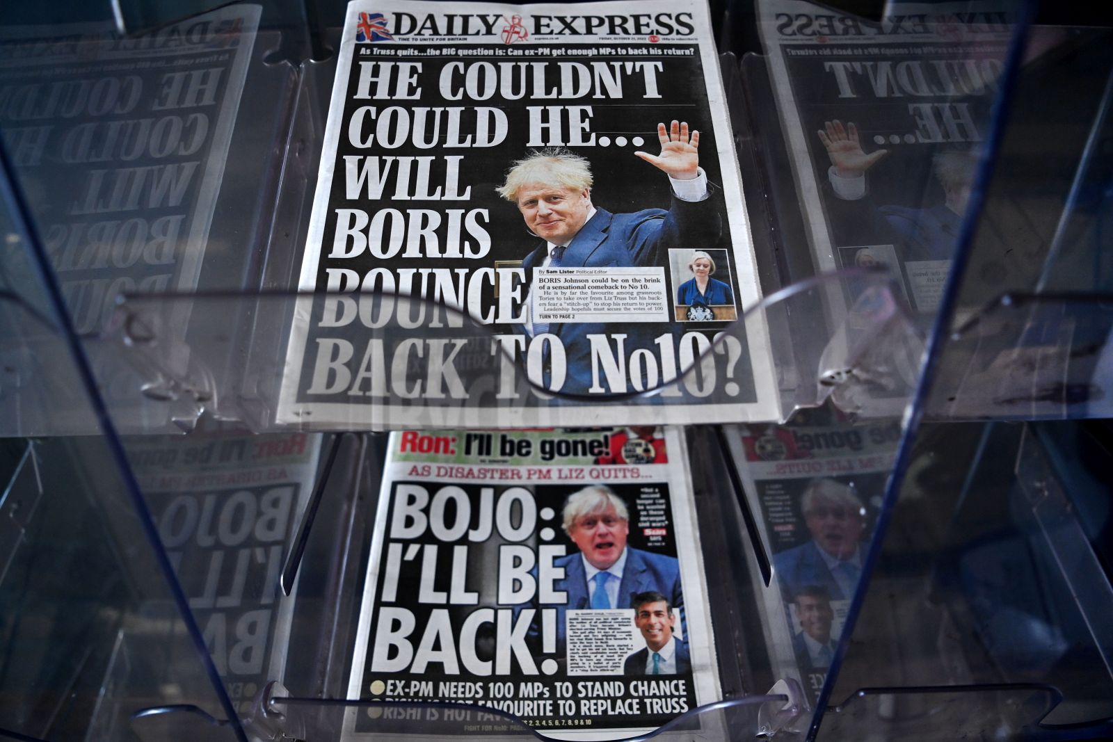 epa10257165 UK newspapers speculate over a possible return of power to former British prime minister Johnson at a store in London, Britain 21 October 2022. Former prime minister Johnson is one among candidates MPs have voiced their support for, a day after Truss announced her resignation as prime minister in a statement outside 10 Downing on 20 October after only 44 days in office. Commons Leader Mordaunt is yet the only one to officially have declared to run for the party's leadership.  EPA/ANDY RAIN