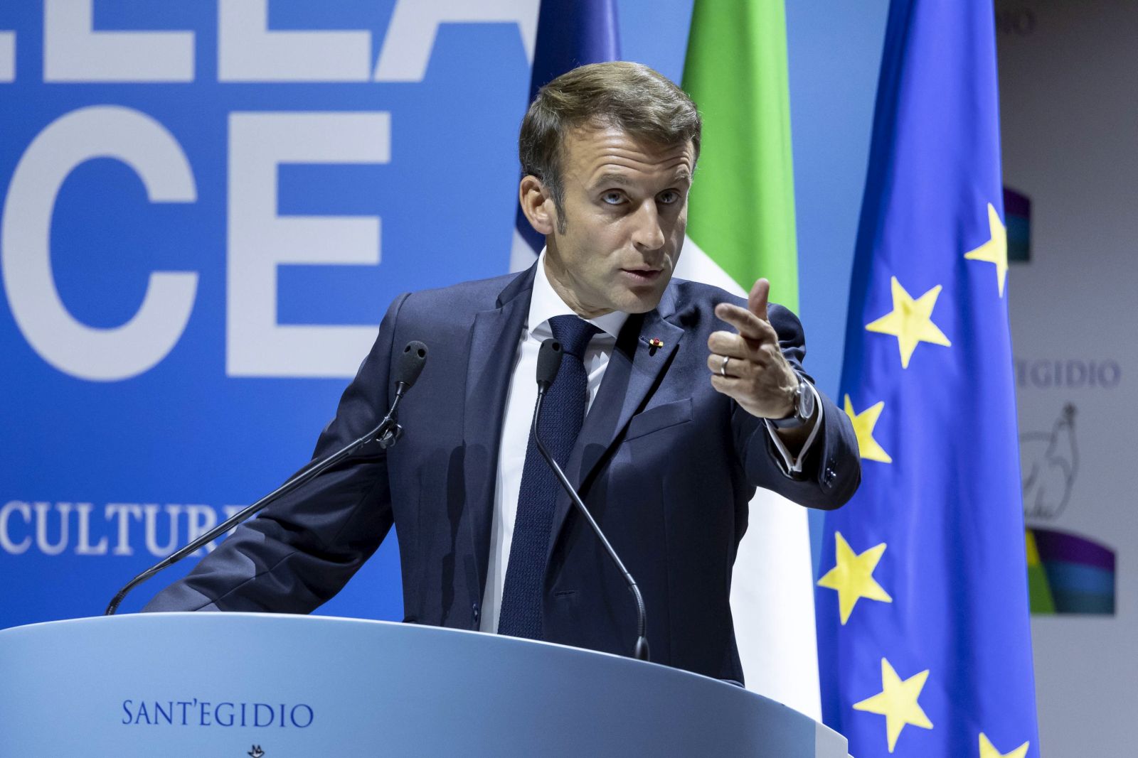epa10261463 President of the French Republic Emmanuel Macron speaks at the international meeting for Peace entitled  'The Cry for Peace -Religions and Cultures in Dialogue' (Il grido della Pace –Religioni e Culture in dialogo), in Rome, Italy, 23 October 2022.  EPA/MASSIMO PERCOSSI