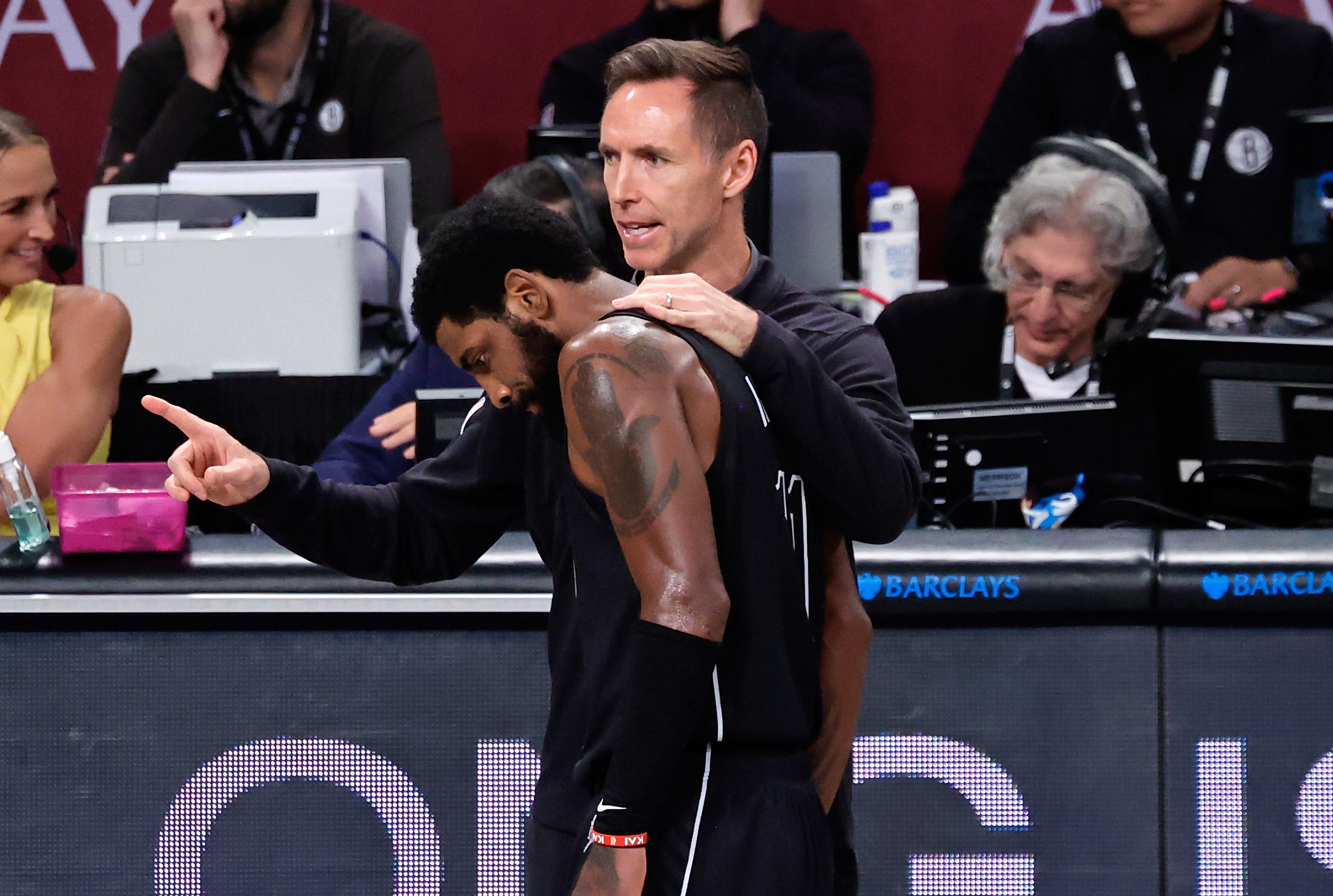 epa10257988 Brooklyn Nets guard Kyrie Irving (C) speak with his head coach Steve Nash during the first half of the NBA basketball game between the Brooklyn Nets and the Toronto Raptors at Barclays Center, in Brooklyn, New York, USA, 21 October 2022.  EPA/Peter Foley  SHUTTERSTOCK OUT