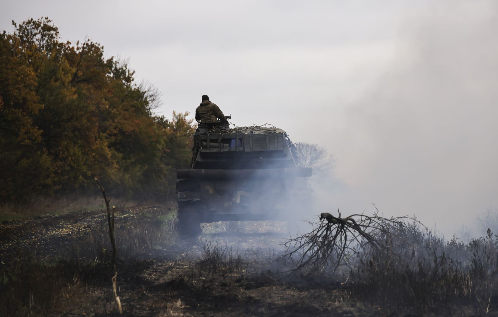 epa10264071 Ukrainian self-propelled artillery near a frontline not far from the city of Bakhmut, Donetsk region, eastern Ukraine, 24 October 2022 (issued 25 October 2022). The Ukrainian army pushed Russian troops from occupied territory in the east and northeast of the country in counterattacks. Russian troops on 24 February entered Ukrainian territory, starting a conflict that has provoked destruction and a humanitarian crisis.  EPA/STRINGER