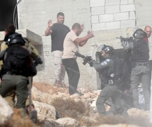 epa10264926 Israeli soldiers detain a Palestinian man during clashes following the demolishing of a Palestinian hous in the village of Bani Naim, in the West Bank near of Hebron, 25 October 2022. According to the Israeli authorities, the house was demolished because it was built without permission.  EPA/ABED AL HASHLAMOUN