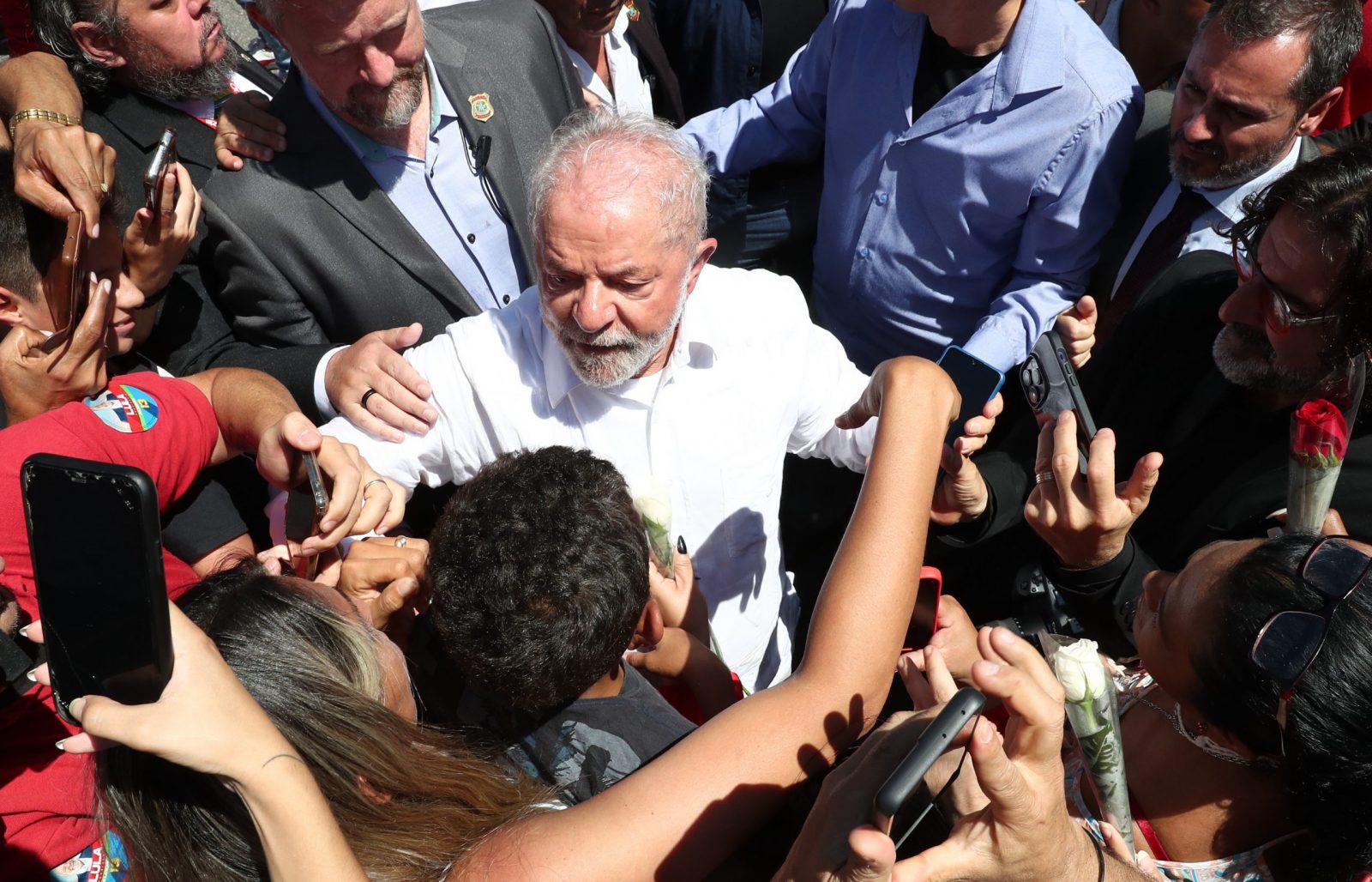 epa10275100 Former Brazilian president and presidential candidate Luiz Inacio Lula da Silva greets supporters during his departure after voting in the second round of the presidential elections in Sao Bernardo do Campo, Sao Paulo, Brazil, 30 October 2022. Brazilians headed to polling stations on 30 October to decide between former President Luiz Inacio Lula da Silva or his rival, current President Jair Bolsonaro, as head of State for the 2022-2026 period.  EPA/Antonio Lacerda