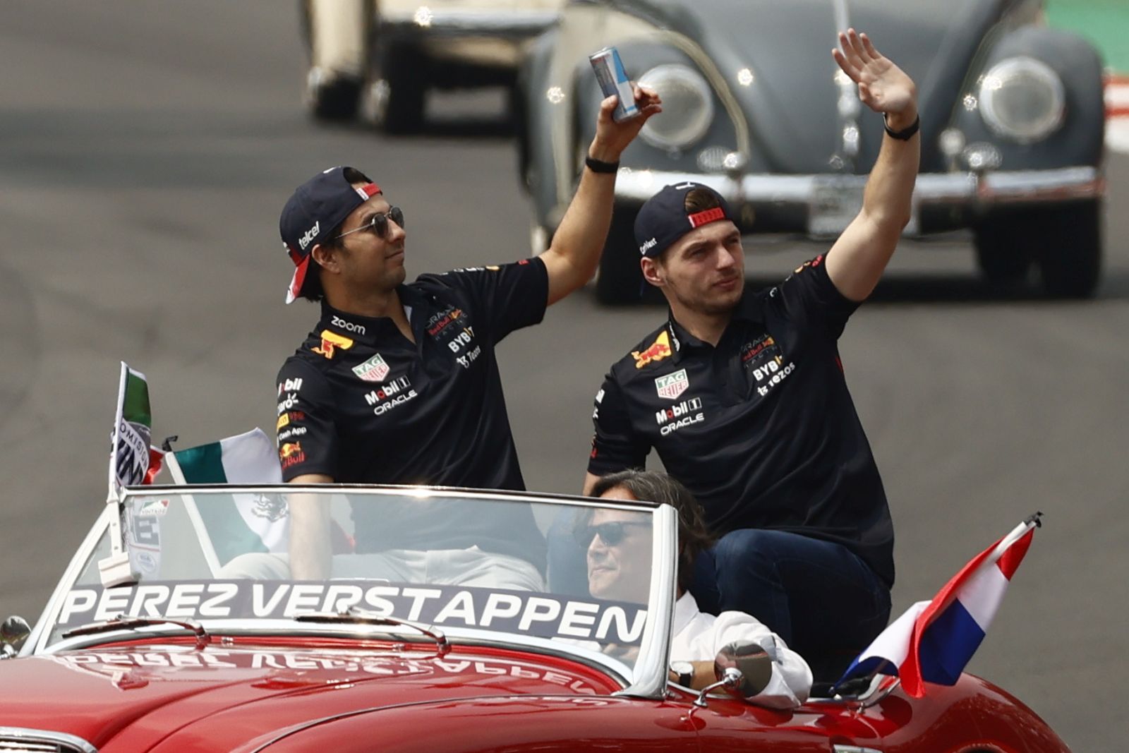 epa10275793 Mexican Formula One driver Sergio Perez (L) and the Dutch Formula one driver Max Verstappen of Red Bull Racing during the parade before the race of the Formula One Grand Prix of Mexico City at the Circuit of Hermanos Rodriguez in Mexico City, Mexico, 30 October 2022. The Formula One Grand Prix of the Mexico City takes place on 30 October 2022 at the Circuit of Hermanos Rodriguez.  EPA/Jose Mendez